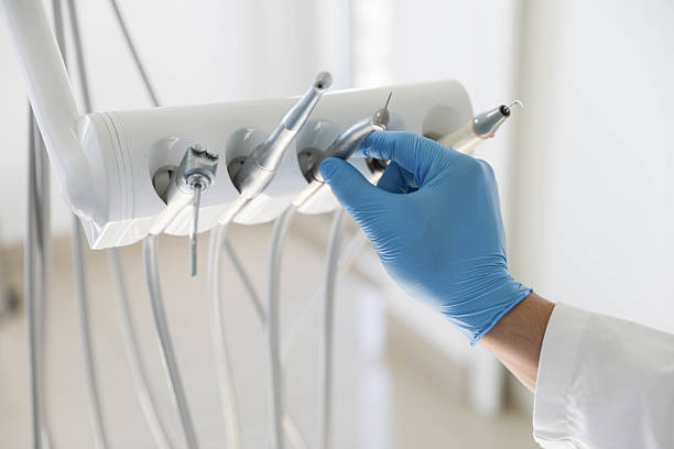 Professional Tooth Extraction technician working in Carteret, NJ